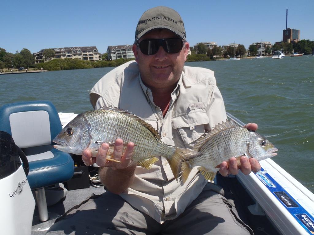 Aaron with a couple of bream that were caught while fishing in Hen and Chicken Bay © Gary Brown